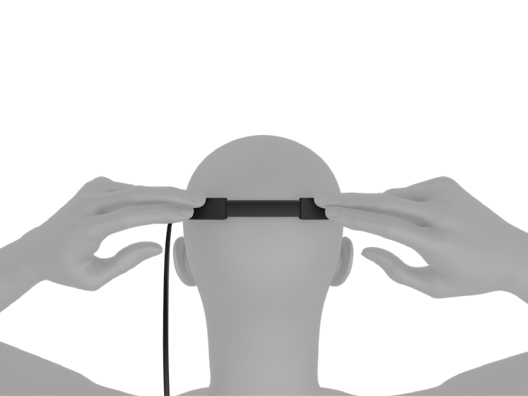 The Magic Leap 2 being fitted to a person's head by pressing in the back band gently.