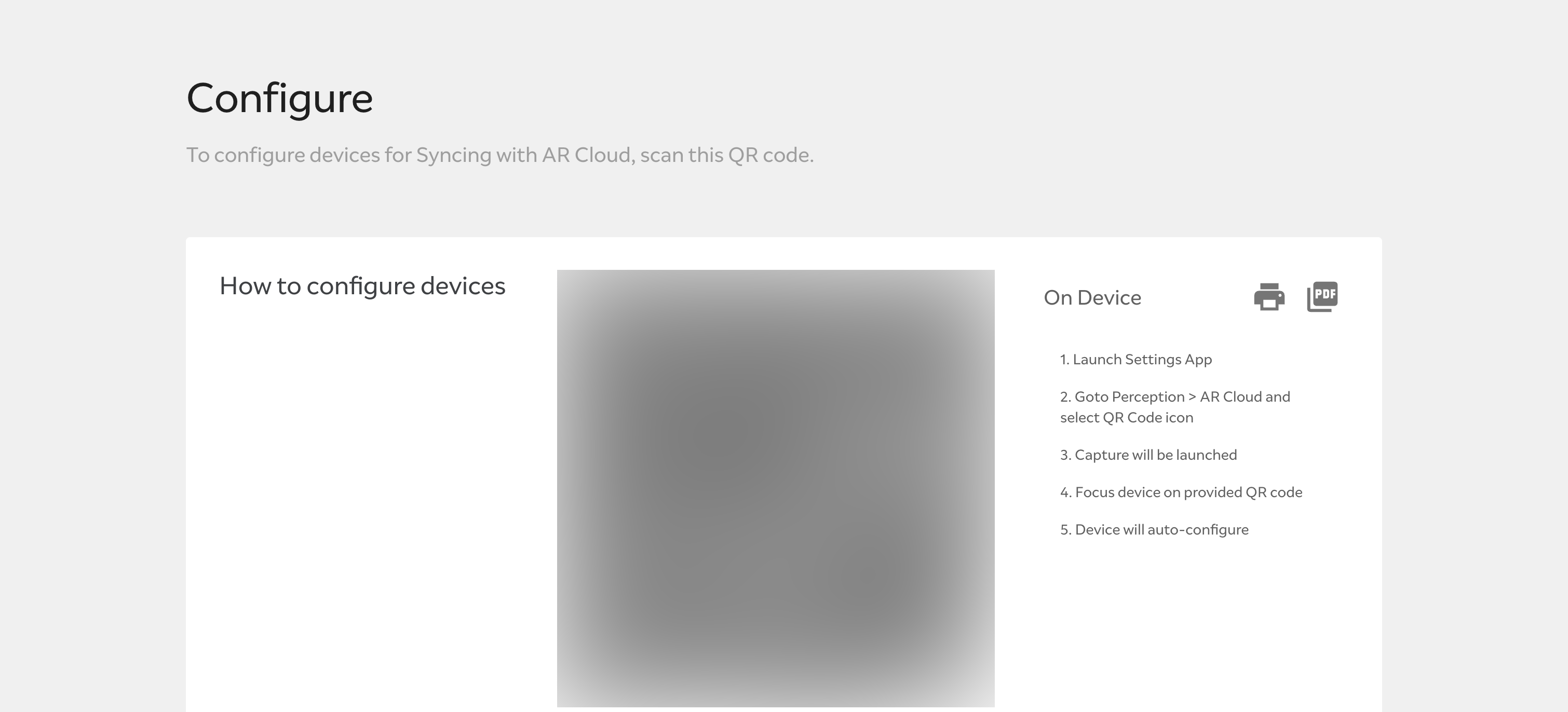 A blurred out QR code for device registration