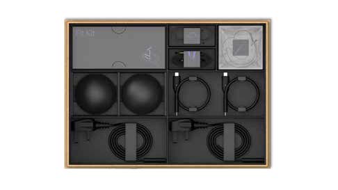 An opened Magic Leap 2 box with the accessories and charging cables